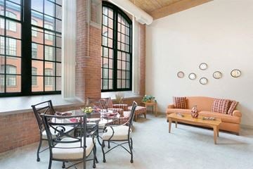 Manchester apartment for rent - a living room with a table and chairs