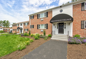 Rocky Hill apartment for rent - A brick building with a sign that says Greenfield Village.