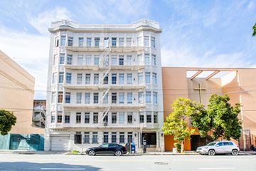 San Francisco apartment for rent - A white building with a blue sky in the background.