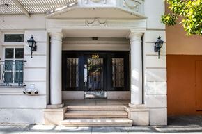 San Francisco apartment for rent - The front of a building with a black door and a number 250 on it.