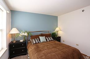 Harvard apartment for rent - a bedroom with a bed and two night stands with lamps