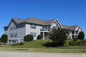 Harvard apartment for rent - a house on a hill with a blue sky