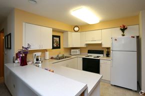 Harvard apartment for rent - a kitchen with a white counter and a refrigerator