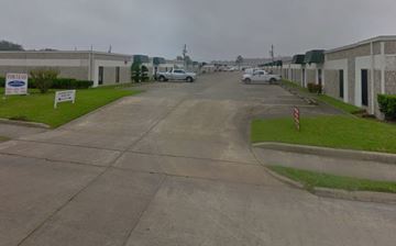 Houston apartment for rent - a parking lot with cars parked in front of a building