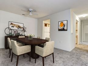 Columbia apartment for rent - a dining room with a table and chairs and a ceiling fan