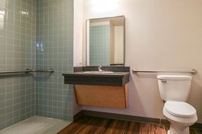 Missoula apartment for rent - a bathroom with a toilet and a sink and a mirror