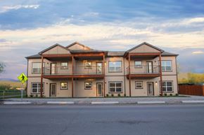 Missoula apartment for rent - an apartment building with a street sign in front of it