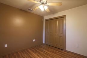 Missoula apartment for rent - a empty room with a ceiling fan and a door