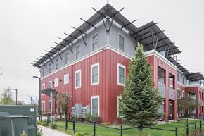 Missoula apartment for rent - a red building with a roof on top of it