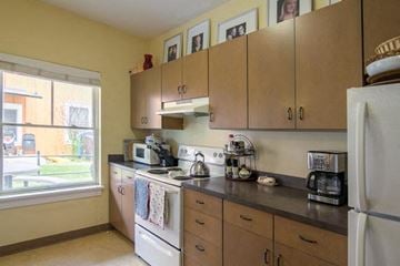 Missoula apartment for rent - a kitchen with a stove and a refrigerator