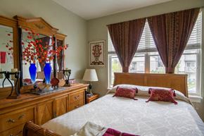Missoula apartment for rent - a bedroom with a large bed and a dresser