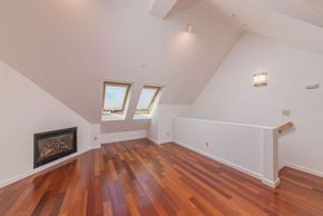 Santa Cruz apartment for rent - Living are with fireplace and window  l 132 Clay Street Apartments