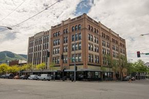 Missoula apartment for rent - a tall building on the corner of a city street
