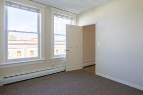 Missoula apartment for rent - an empty room with a door and two windows