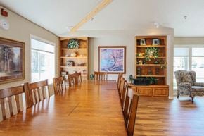 Missoula apartment for rent - a large dining room with a wooden table and chairs