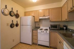 Missoula apartment for rent - a kitchen with a stove and a refrigerator