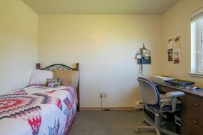 Missoula apartment for rent - a bedroom with a bed and a desk with a chair