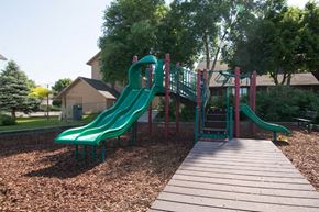 Missoula apartment for rent - a playground with slides and a wooden deck