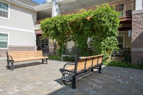 Missoula apartment for rent - two benches on a patio in front of a building