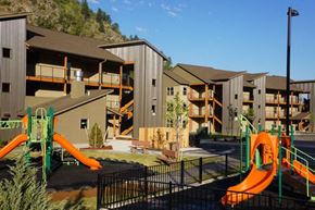 Missoula apartment for rent - an apartment complex with childrens slides and a playground