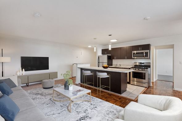 Lancaster apartment for rent - a living room with a kitchen and a couch and a table