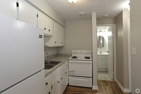 Lodi apartment for rent - a kitchen with white appliances and white cabinets