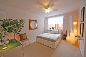 Shaker Heights apartment for rent - a bedroom with a bed and a ceiling fan