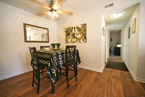 Spartanburg apartment for rent - a dining room with a table and chairs and a ceiling fan