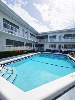 Bay Harbor Islands apartment for rent - a large swimming pool in front of an apartment building