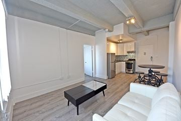Miami Beach apartment for rent - a living room with a white couch and a coffee table