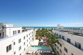 Miami Beach apartment for rent - a view of the pool and the ocean from the roof of a hotel