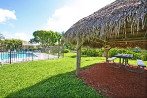 Homestead apartment for rent - a pavilion with a picnic table next to a pool
