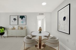 N. Miami apartment for rent - A dining room with a white table and chairs.