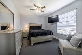 N. Miami apartment for rent - a bedroom with a bed and a ceiling fan