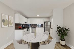 N.Miami Beach apartment for rent - A modern kitchen with a dining table and chairs.