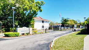 Fort Pierce apartment for rent - the entrance to a school with a road and a fence