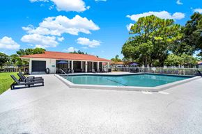 Fort Pierce apartment for rent - A pool with a building behind it.