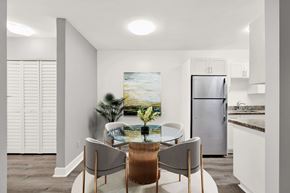 N. Miami Beach apartment for rent - A modern kitchen with a dining table and chairs.