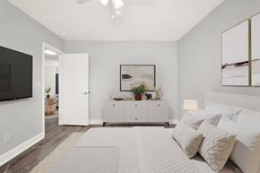 N. Miami Beach apartment for rent - A bedroom with a bed, a dresser, and a television.
