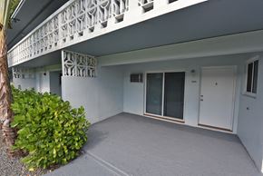 N. Miami Beach apartment for rent - an outside view of a white building with a patio and a door