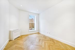 Brooklyn apartment for rent - a living room with wood floors and a window