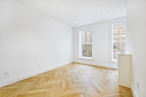 Brooklyn apartment for rent - a living room with a hardwood floor and a window