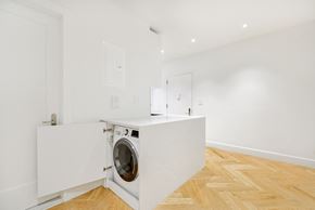 Brooklyn apartment for rent - a white laundry room with a washing machine in it