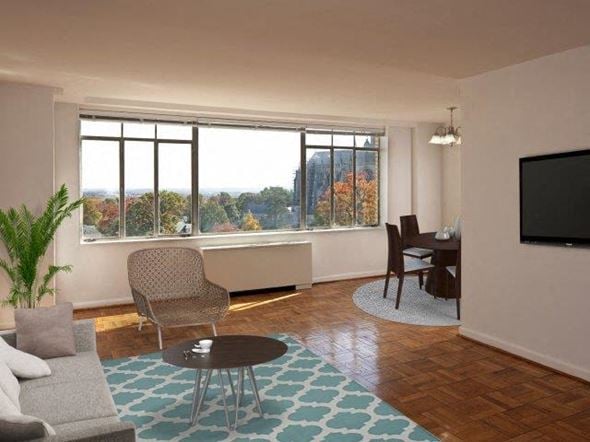Washington apartment for rent - a living room with a couch and a table and a television