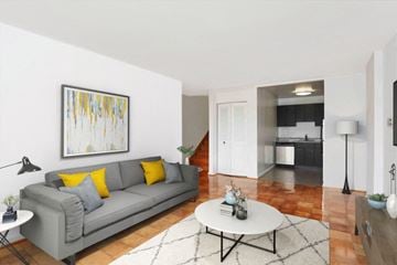 Washington apartment for rent - a living room with a couch and a coffee table