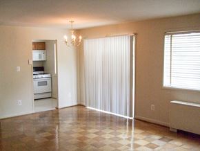 Herndon apartment for rent - an empty living room and kitchen with a sliding glass door