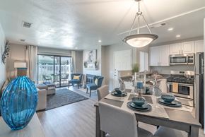 Redlands apartment for rent - A modern kitchen with a dining table set for two.