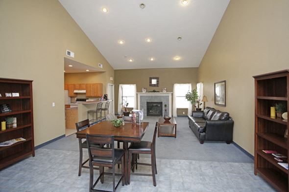 Shawnee apartment for rent - a large living room with a dining room table and a fireplace