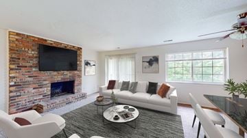 Mission apartment for rent - a living room with a couch and a fire place