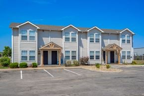 Gardner apartment for rent - the exterior of a building with a parking lot